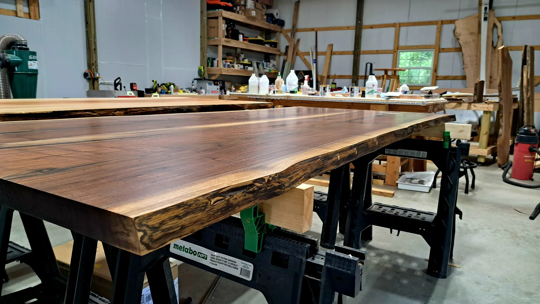 family walnut table from their tree behind the build photo 13