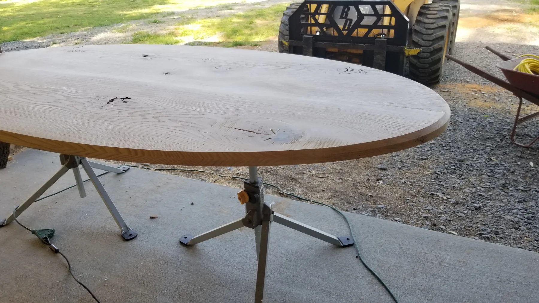 White oak oval dining table behind the build photo 1