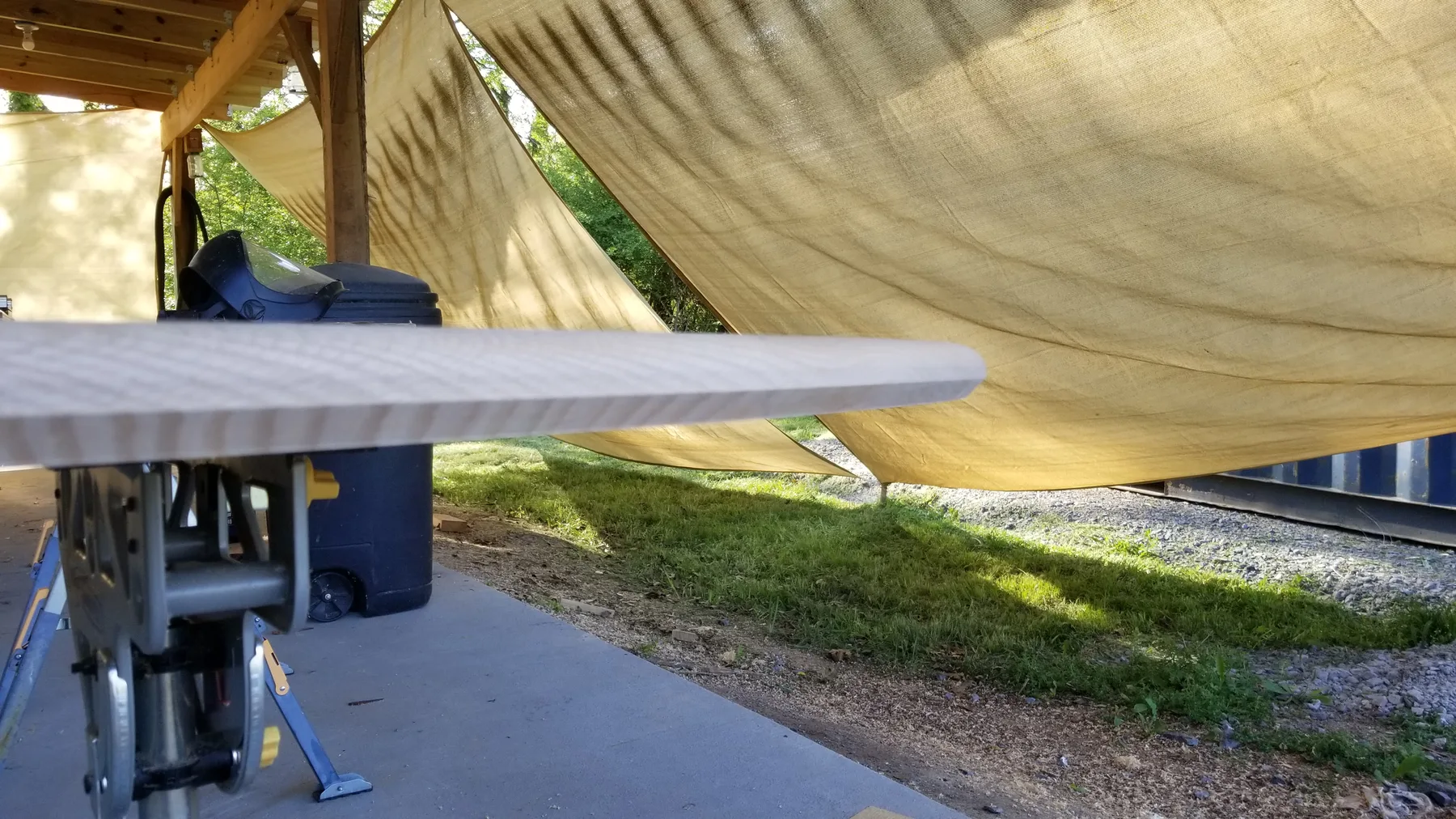 White oak oval dining table behind the build photo 4