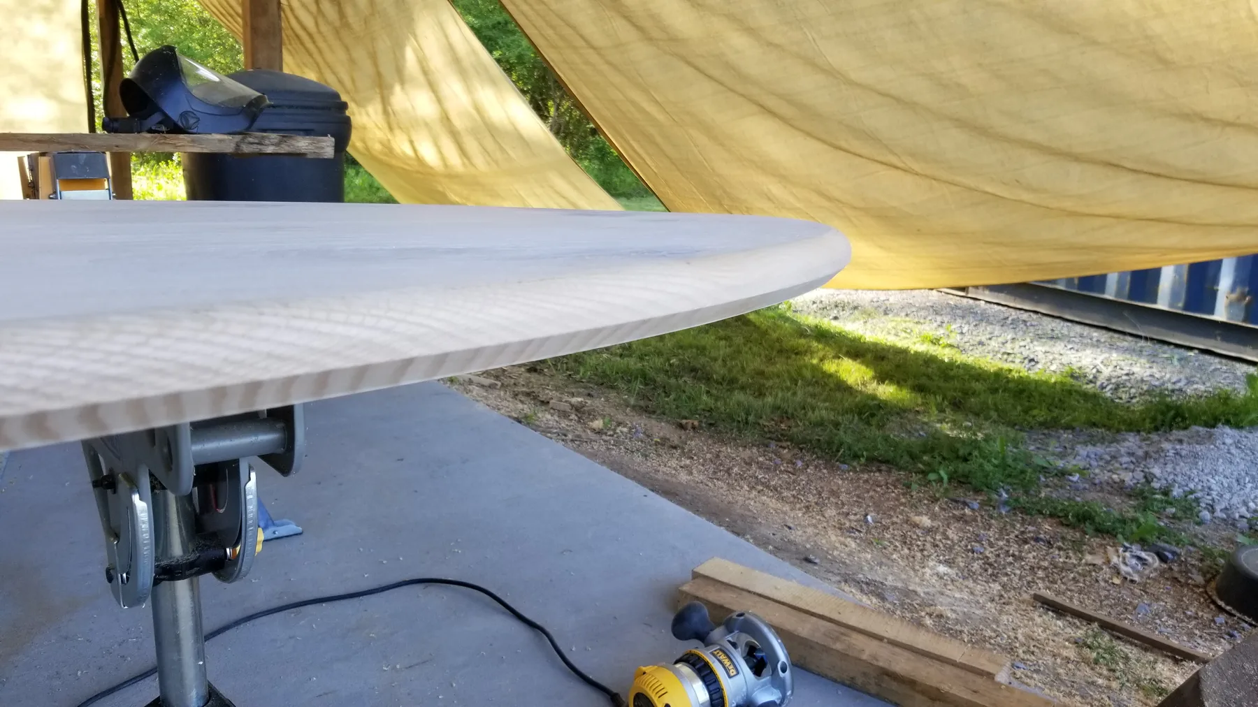 White oak oval dining table behind the build photo 5