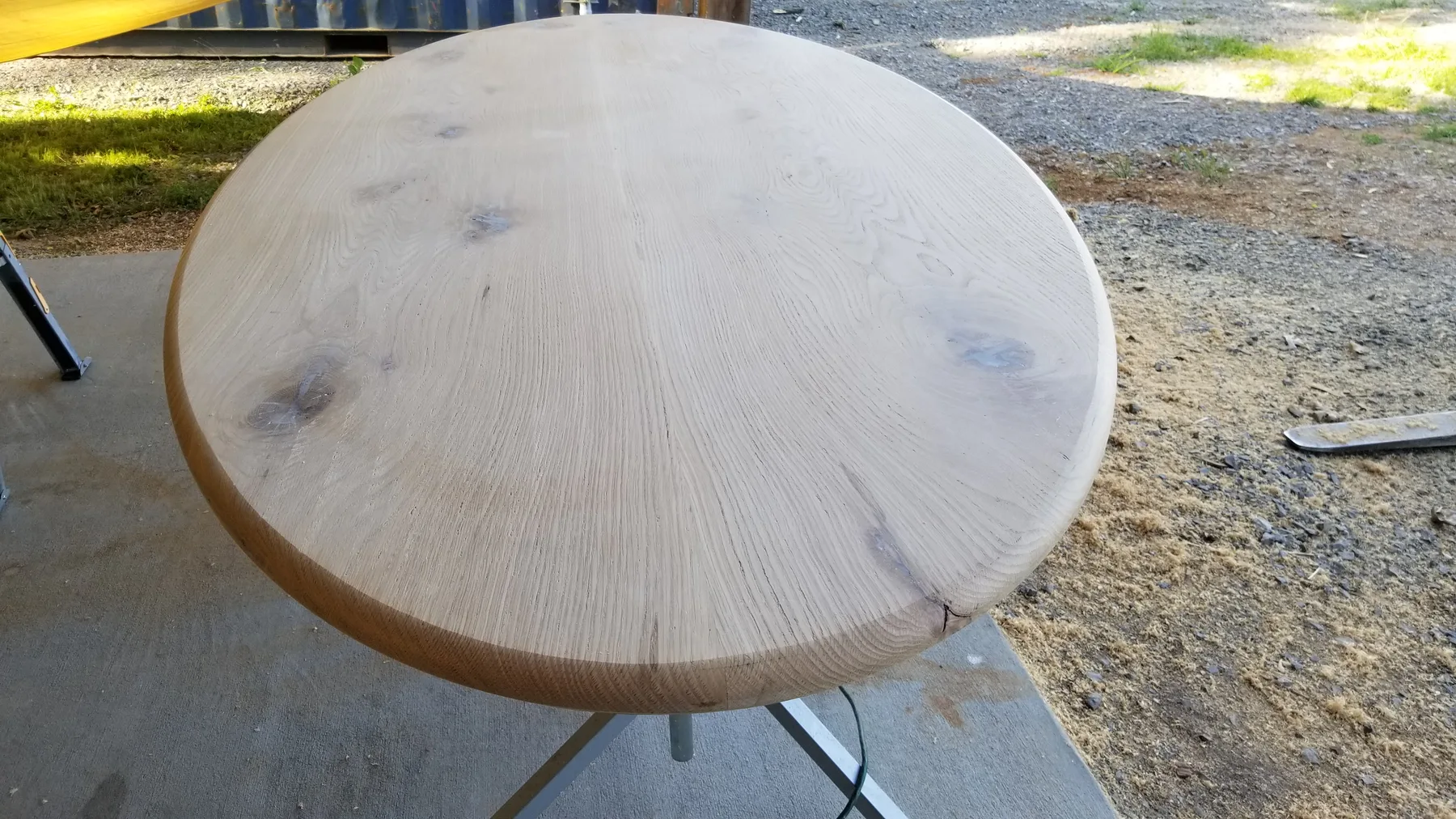 White oak oval dining table behind the build photo 7