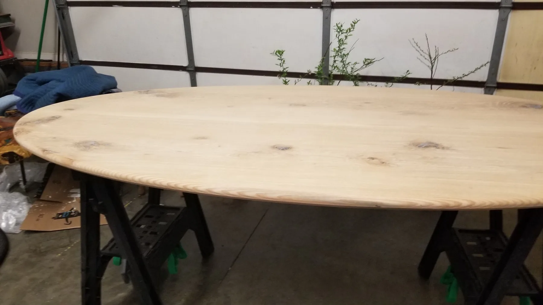 White oak oval dining table behind the build photo 9